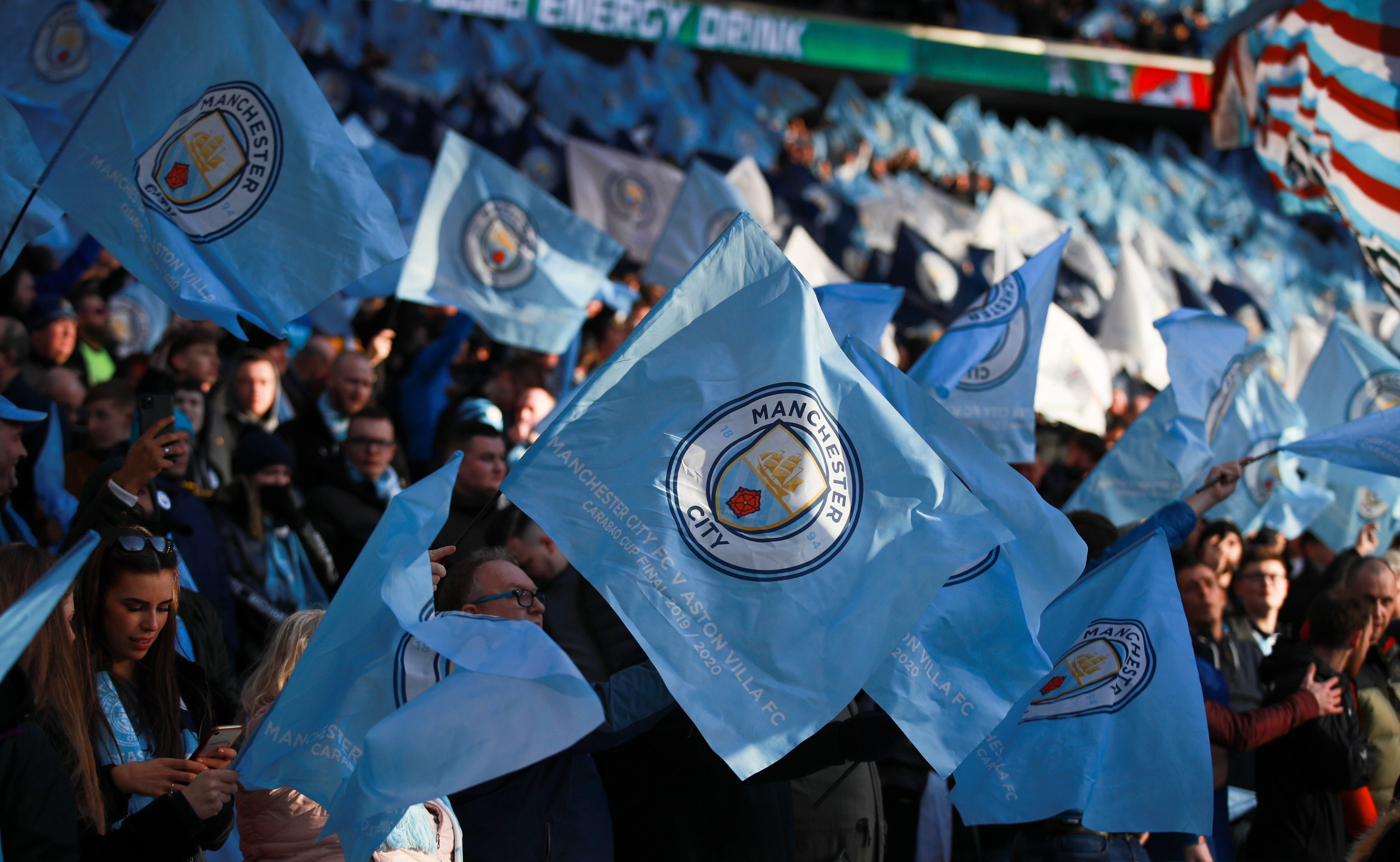 Manchester City fans wave the team's flag