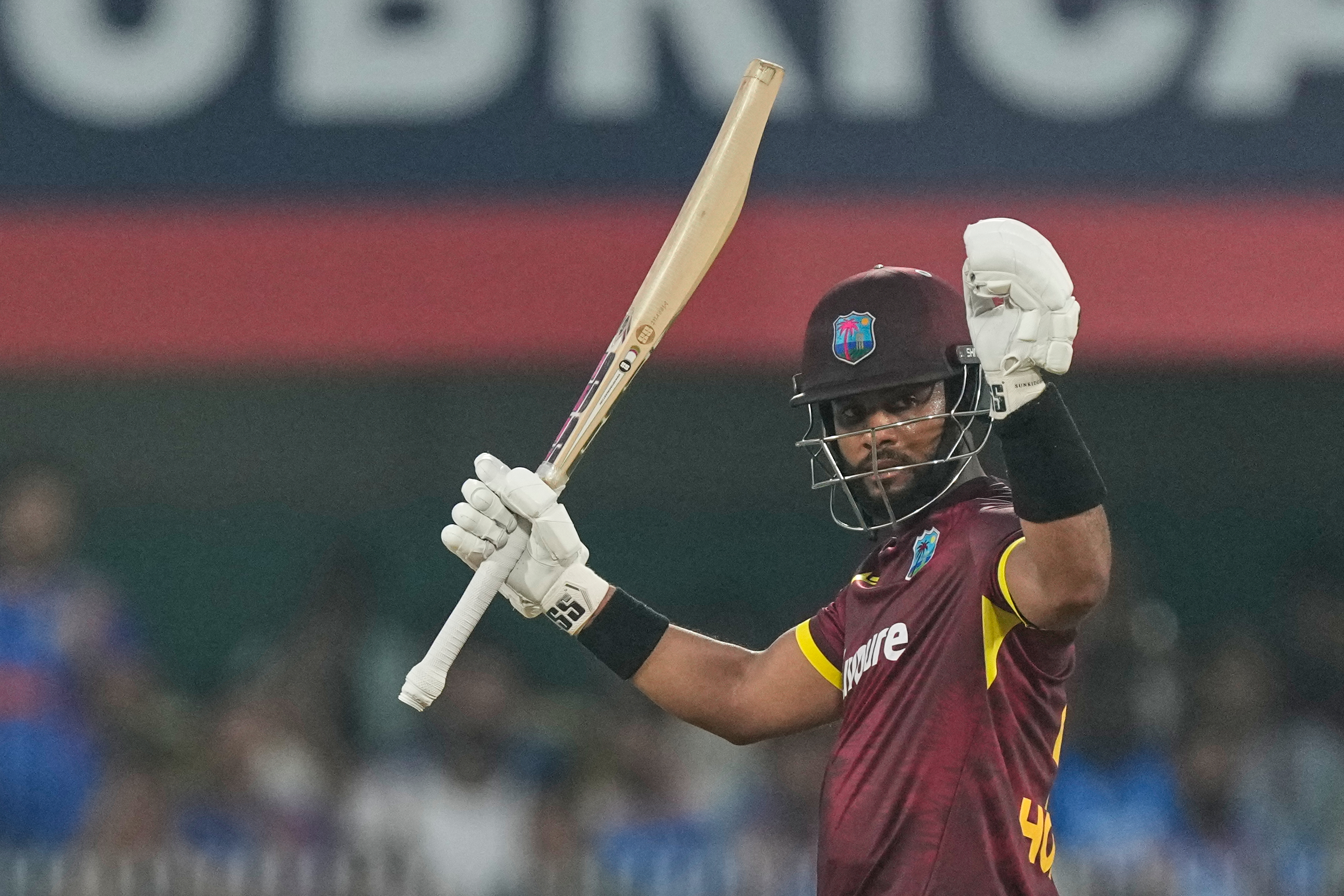 West Indies' captain Shai Hope celebrates his century against India