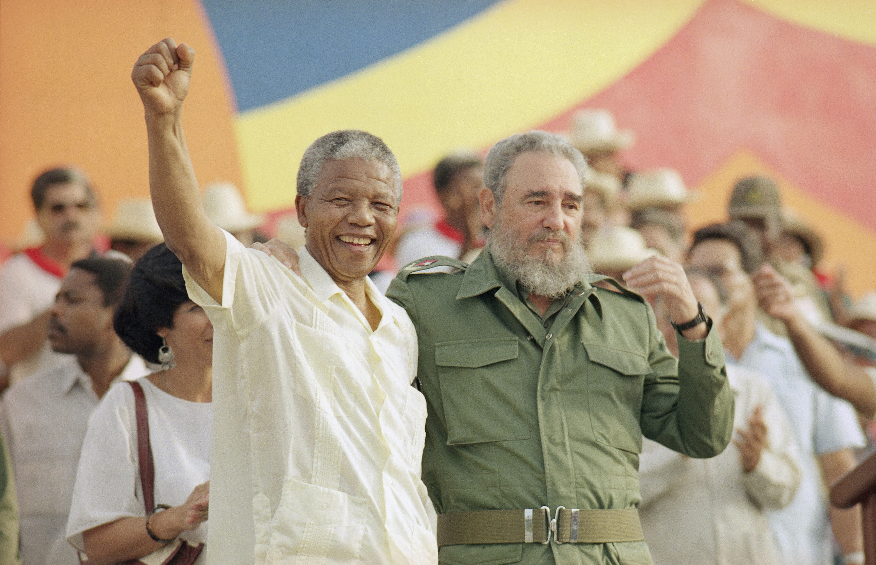 Cuban President Fidel Castro, right, and African leader Nelson Mandela gesture during the celebration of the "Day of the Revolution" in Matanzas Saturday, July 27, 1991. Cubans celebrate 38th anniversary of the revolution.(AP Photo)