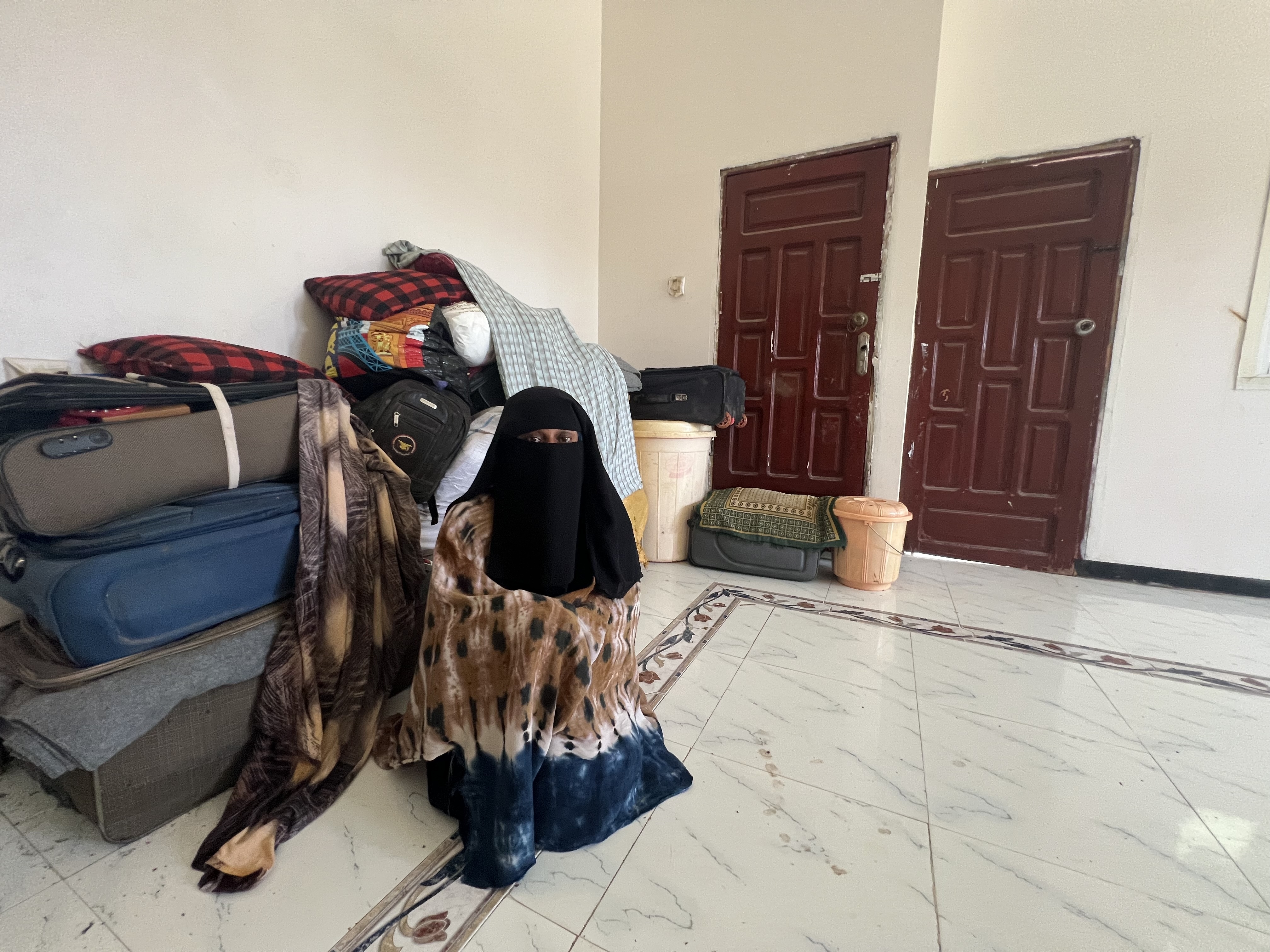 For Fatima, Mohammed’s wife, however, her biggest concern is neither accommodation nor even food, but how to repay the clothing [Do not use - Saeed al-Batati/Al Jazeera]
