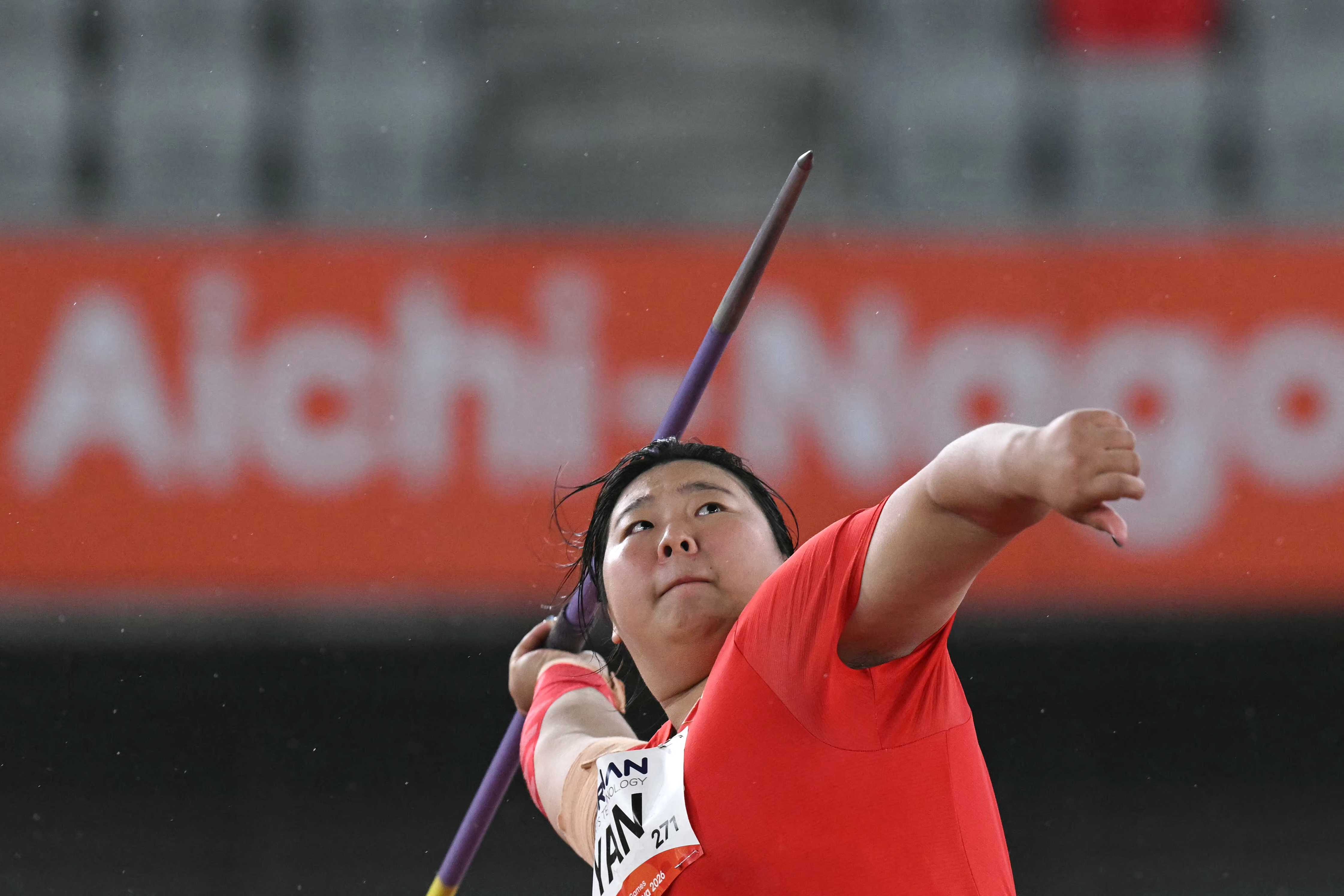 China's Yan Ziyi competes in the women's javelin throw final during the 2026 Asian Games at Nagoya City Mizuho Park Athletic Stadium in Nagoya, Aichi Prefecture on September 27, 2026. (Photo by MOHD RASFAN / AFP)