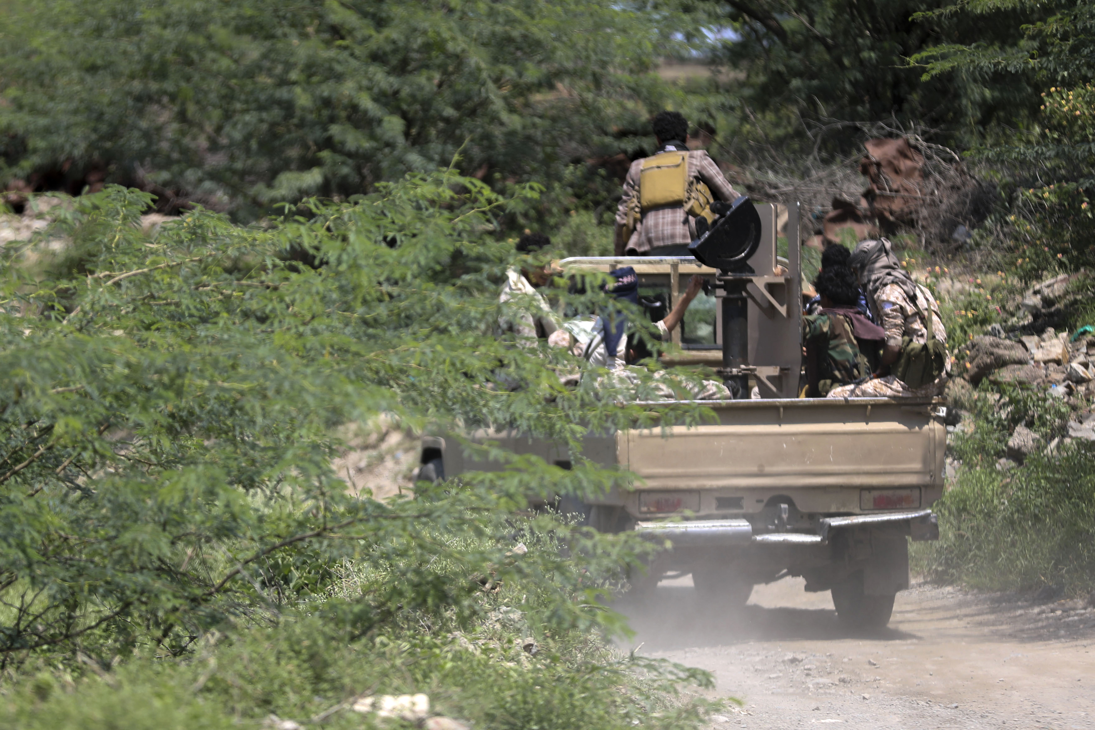 Saudi-backed Yemen government soldiers ride in a pick-up truck near the Jabal Han front, west of the city of Taiz, following fierce battles earlier in the day as Yemen's Houthis reportedly attempted to seize control of the main route between the inland city of Taiz and the coastal city of Aden, on October 3, 2026.