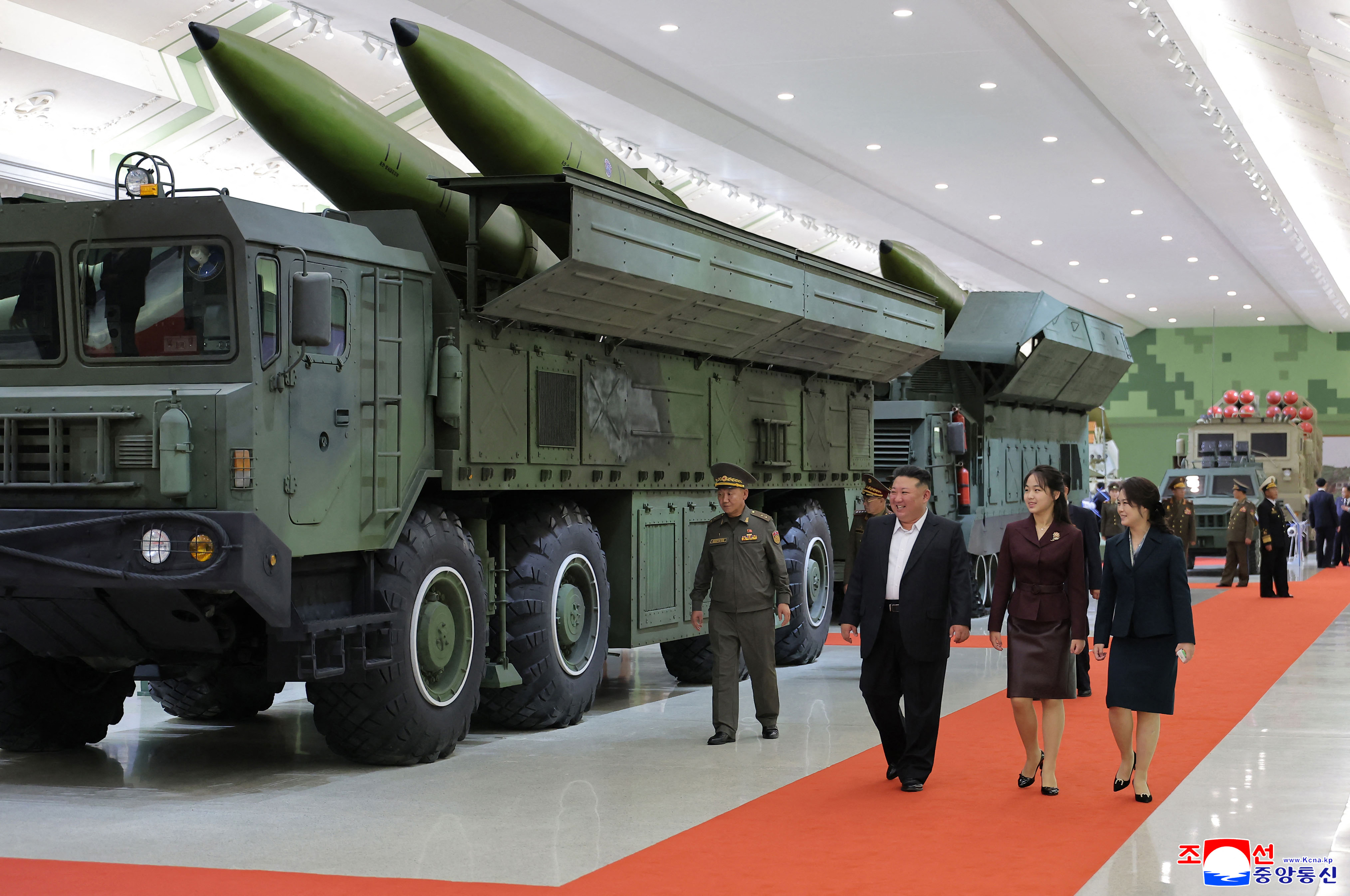 This picture taken on October 11, 2026 and released by North Korea's official Korean Central News Agency (KCNA) on October 13, 2026 shows North Korean leader Kim Jong Un, his wife Ri Sol Ju and his daughter Kim Ju Ae touring the Second Economic Committee National Defense Revolution Museum in Pyongyang.