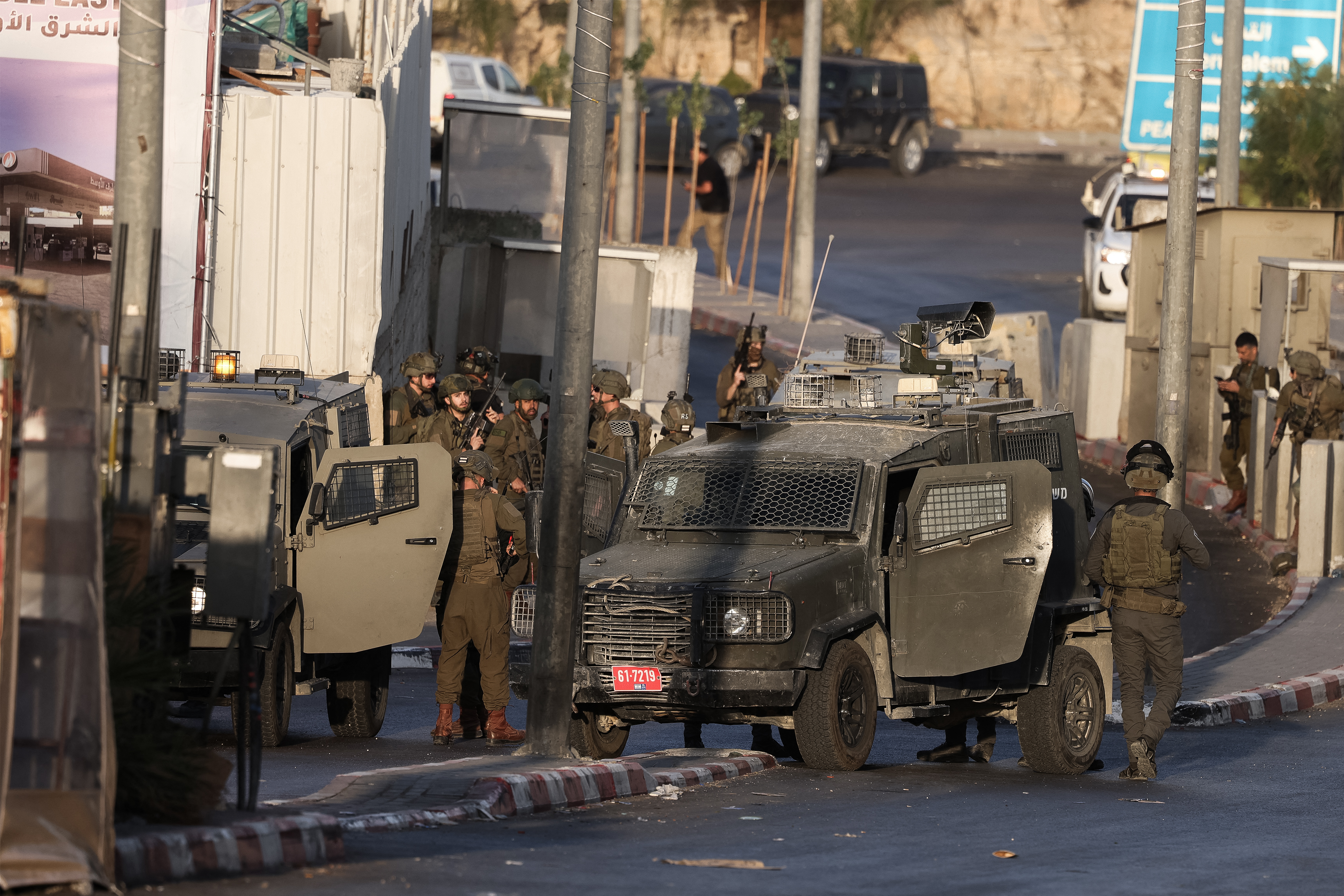 Israeli forces deploy at the scene following a fire exchange with two armed Palestinian men at the northern checkpoint of Hebron in the Israeli-occupied West Bank on October 23, 2026.