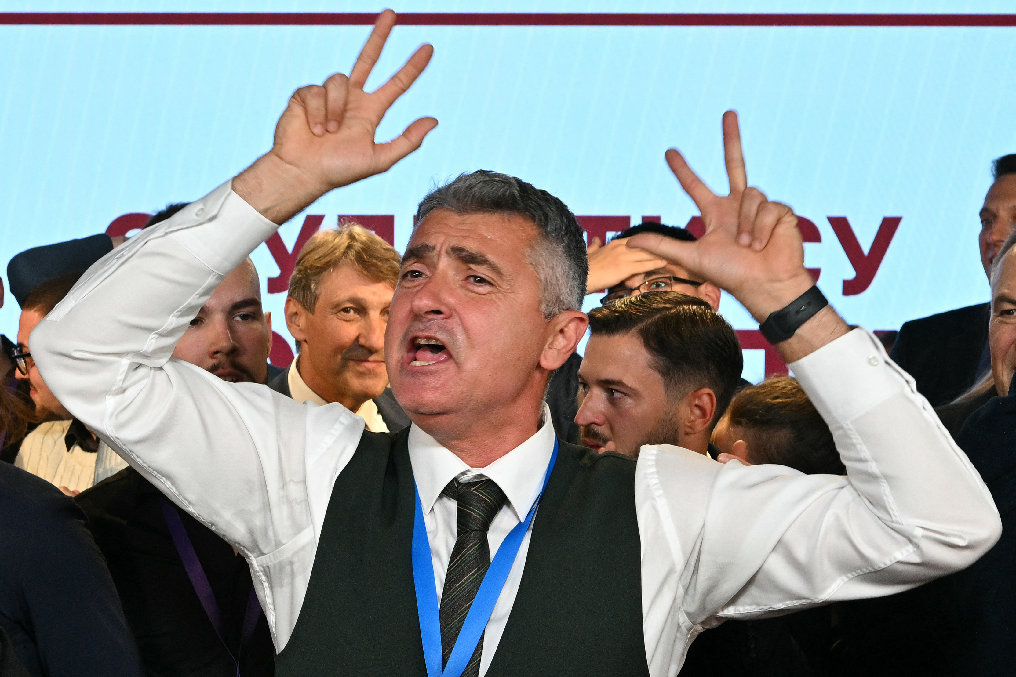Ilija Srdanovic, main candidate on the student-backed electoral list, celebrates the news that Serbia's ruling party have conceded defeat in the Serbian parliamentary elections, at the Students’ List headquarters in Belgrade on October 25, 2026.