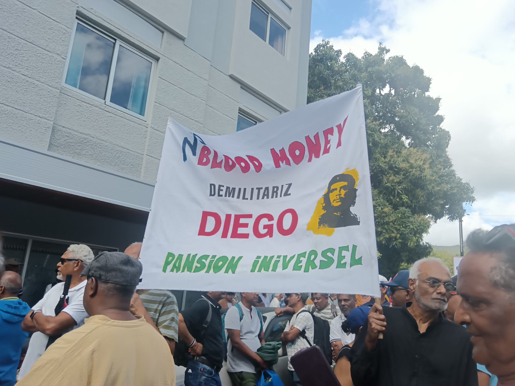 Lalit-affiliated activists hold a banner calling for the closure of the Diego Garcia military base during a protest in Mauritius in July [Ameerah Arjanee/Al Jazeera]