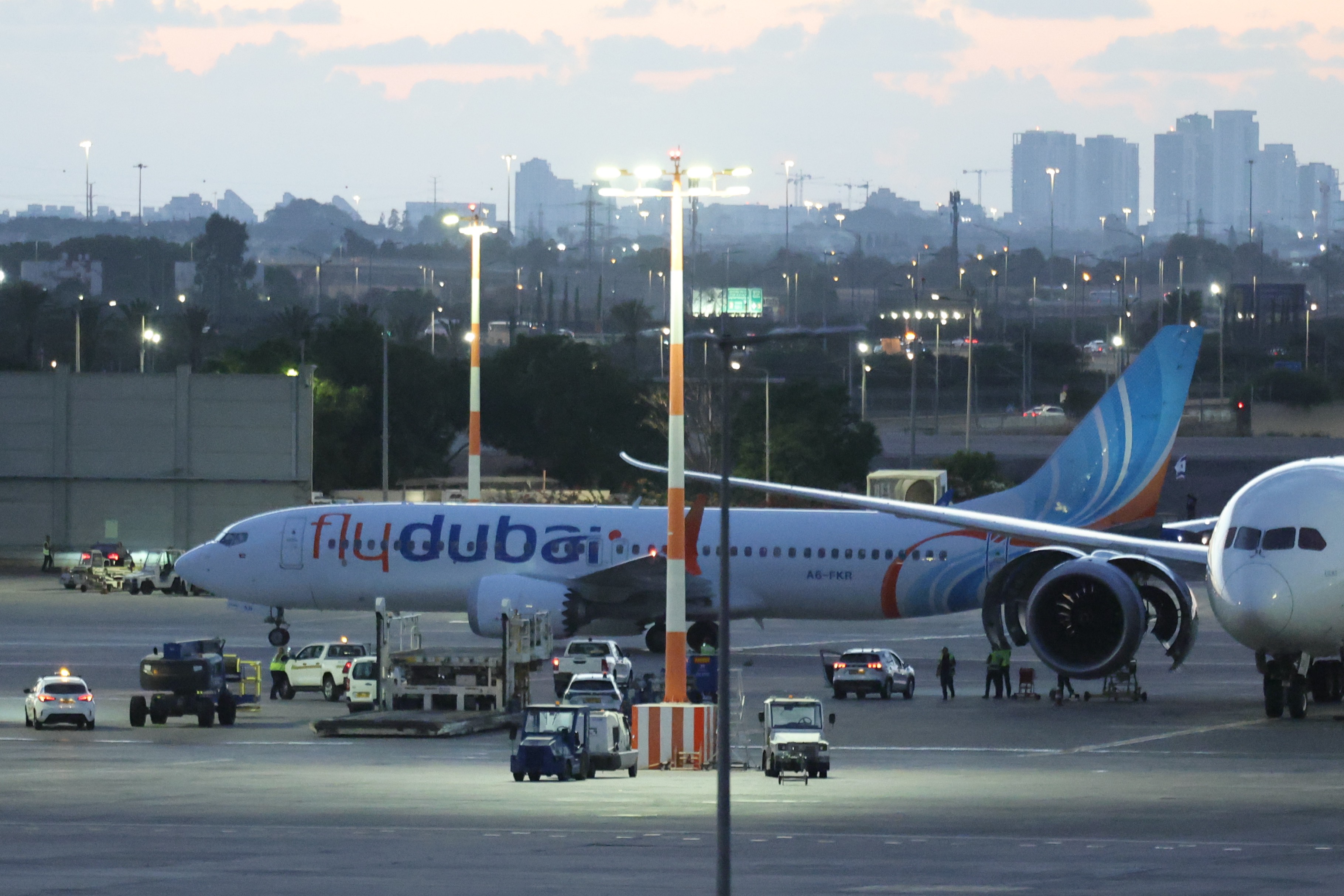 epa13273002 A Flydubai aircraft carrying passengers from Tabuk, Saudi Arabia, stands on the tarmac after landing at Ben Gurion International Airport near Tel Aviv, Israel, 30 September 2026. Flydubai confirmed that flight FZ 1073 from Dubai to Tel Aviv experienced an in-flight incident and diverted safely to Tabuk Airport in Saudi Arabia following an altercation in the flight deck, before passengers were safely transported to their destination. EPA/ABIR SULTAN
