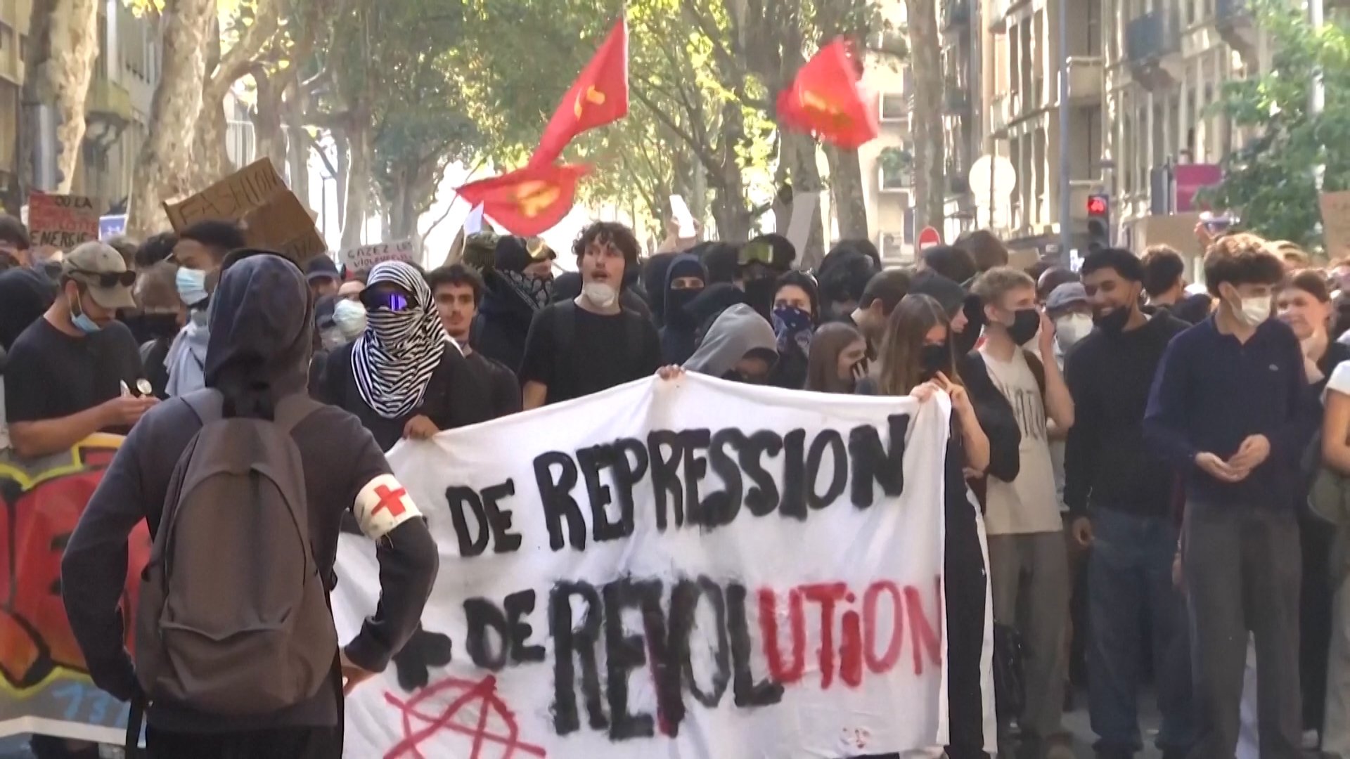Students holding a banner protesting