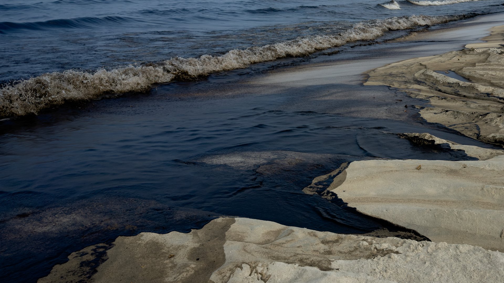 Oil slick on beach