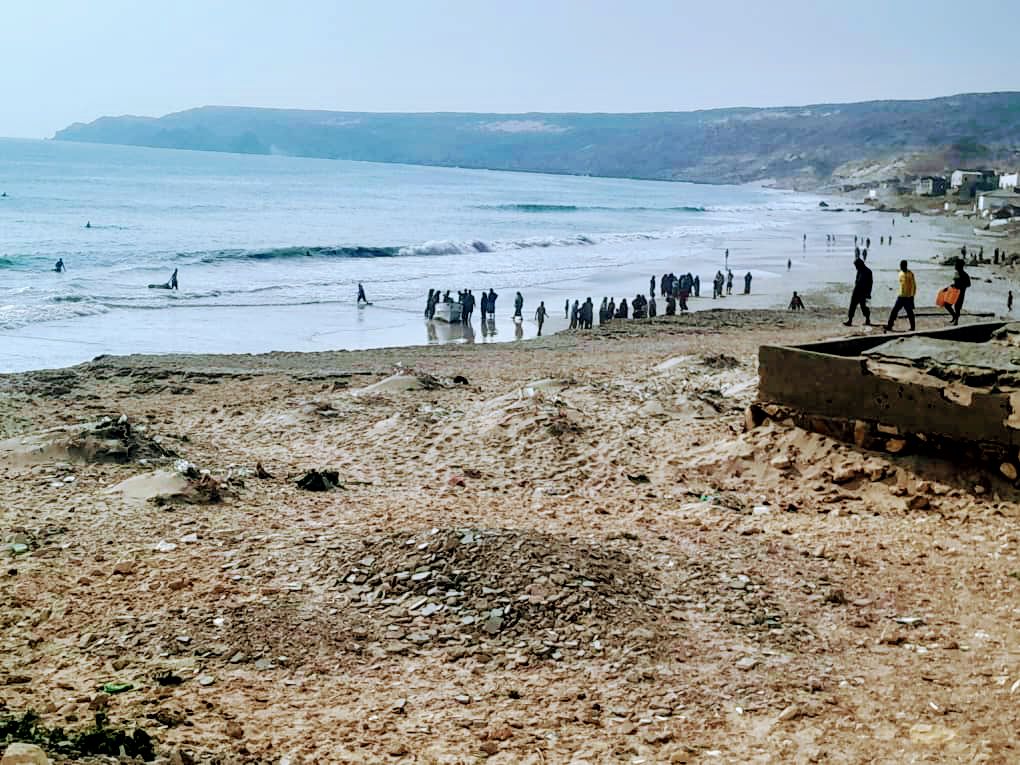 Fishermen and local fishing boats along the shore in Bander Beyla, on Somalia’s Puntland coast.