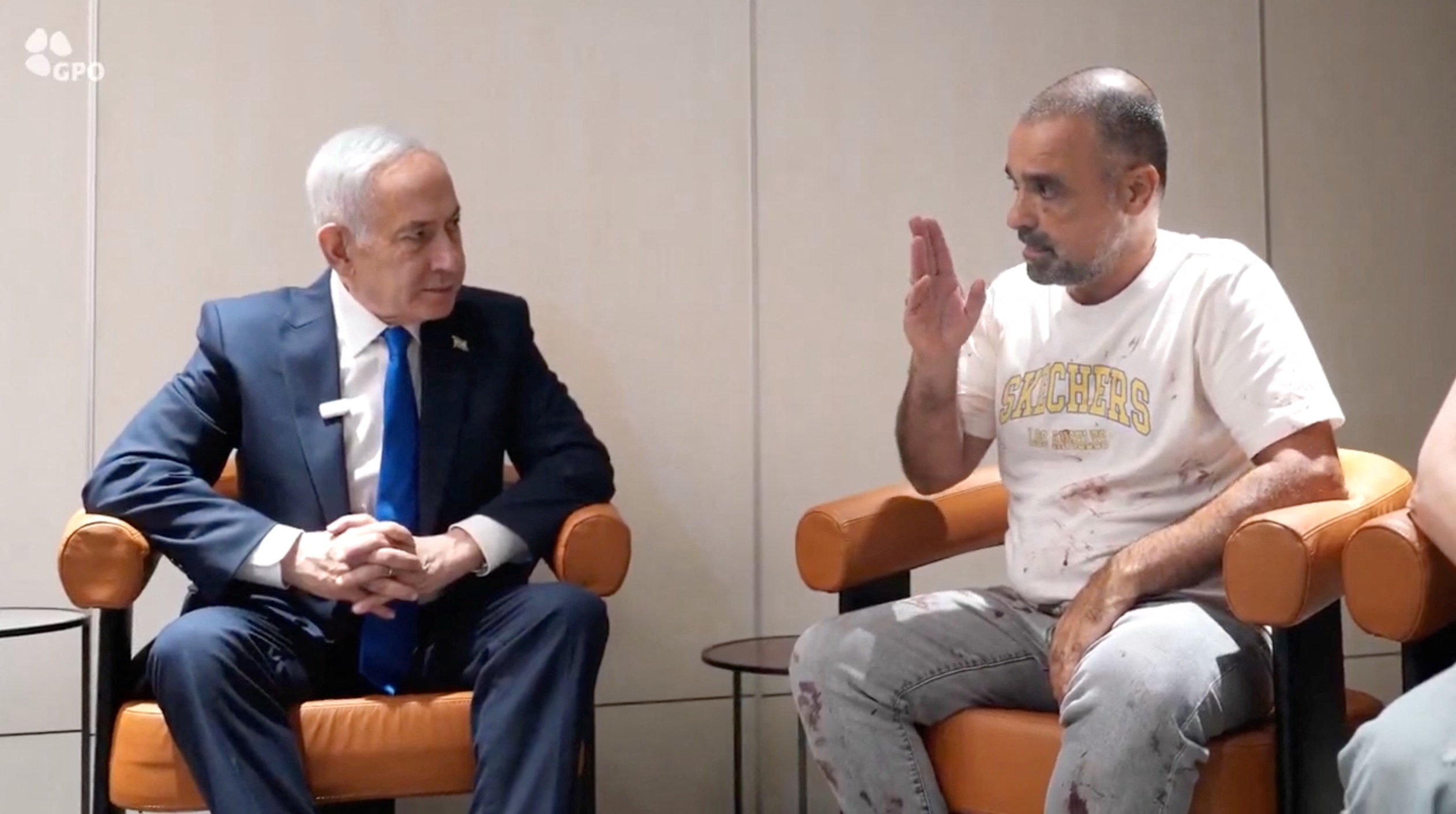 Israeli Prime Minister Benjamin Netanyahu meets Yaniv Hayun, a passenger on the FlyDubai flight bound for Israel from the United Arab Emirates, which was diverted to Saudi Arabia following an emergency signal, at the Ben Gurion Airport, Israel, October 1, 2026. GPO/Handout via REUTERS THIS IMAGE HAS BEEN SUPPLIED BY A THIRD PARTY. OVERLAY FROM SOURCE.