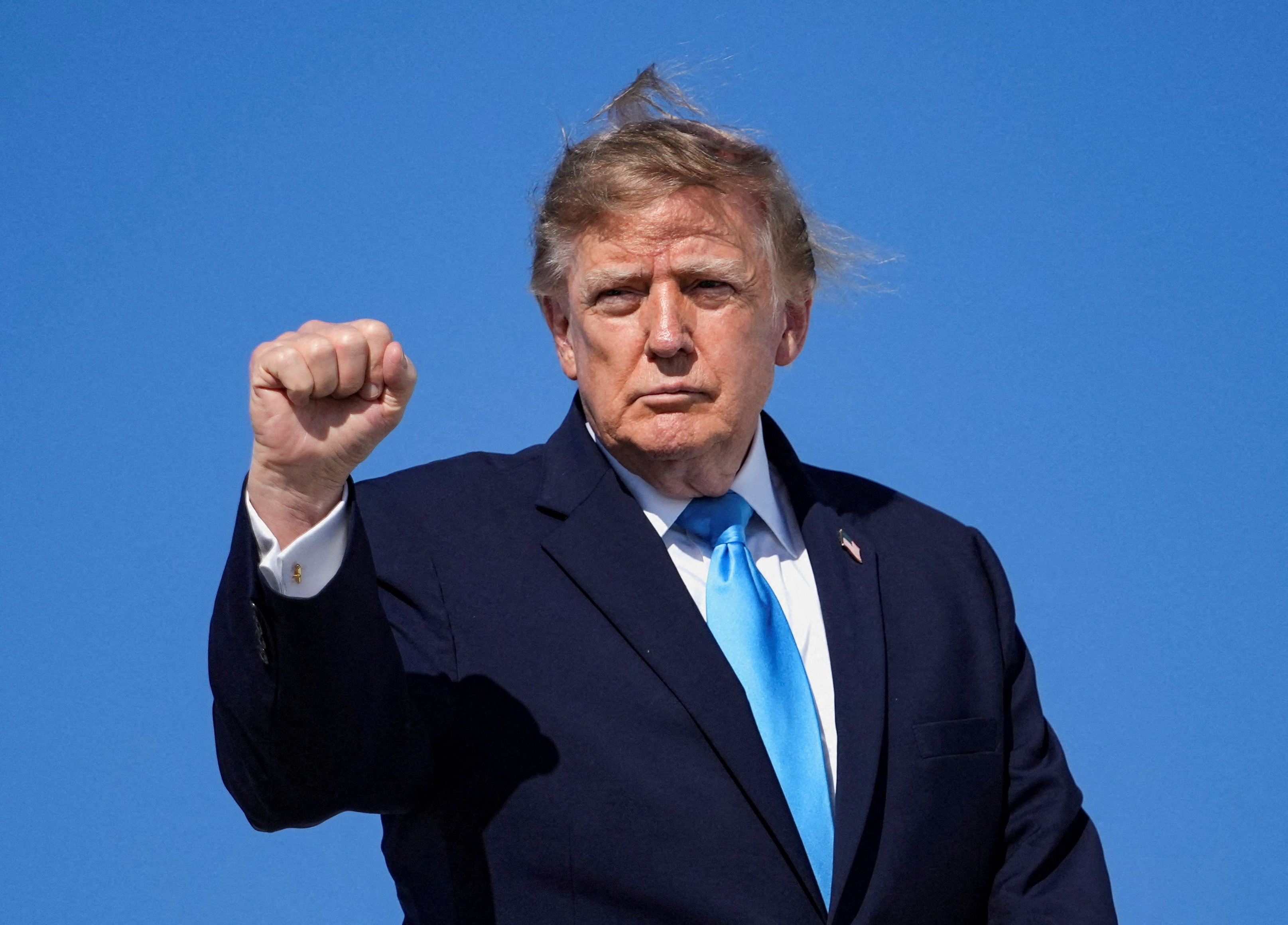 US President Donald Trump makes a fist as he boards Air Force One en route to Grand Island, Nebraska, at Joint Base Andrews, Maryland, US, October 5, 2026. REUTERS/Nathan Howard