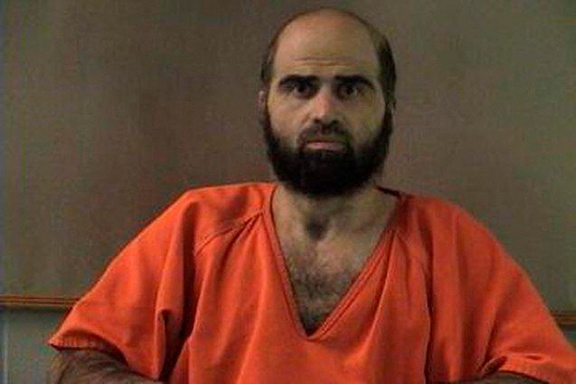 Nidal Hasan in orange prison uniform.
