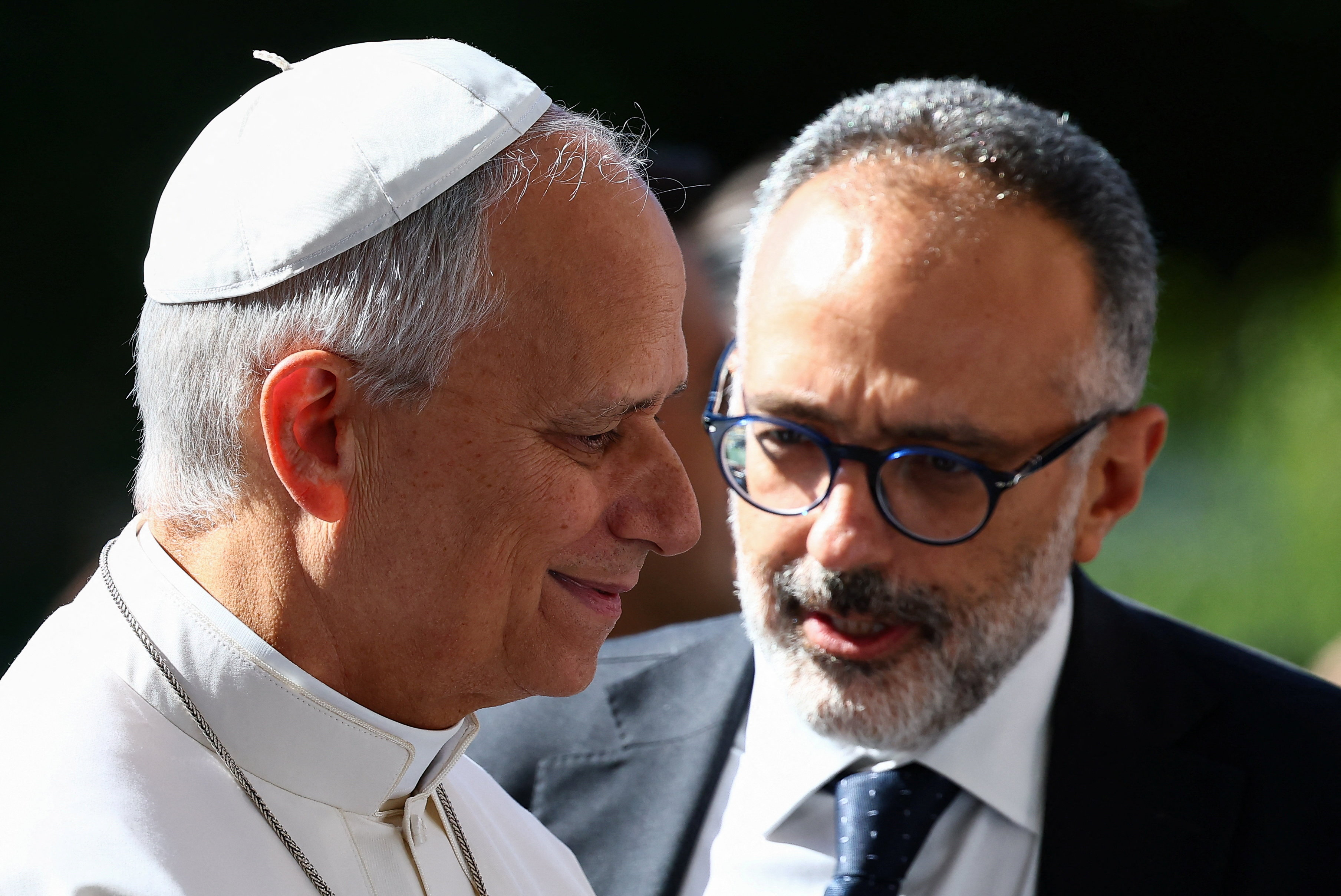 Pope Leo talks with his personal physician, Luigi Carbone, upon arriving at Gemelli Hospital ahead of surgery to remove a lung nodule, in Rome, Italy, October 13, 2026. REUTERS/Guglielmo Mangiapane