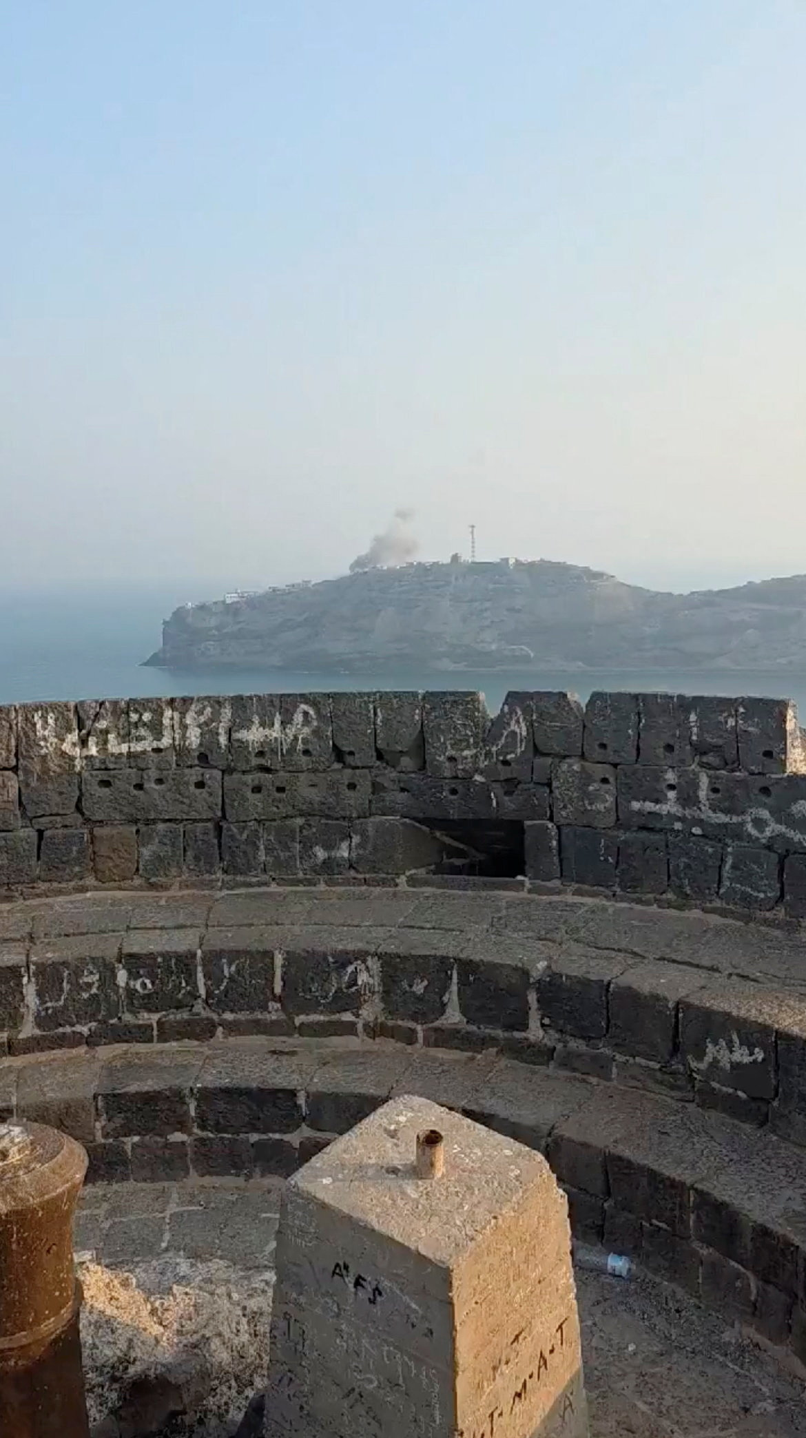 Smoke billows from the presidential palace complex.