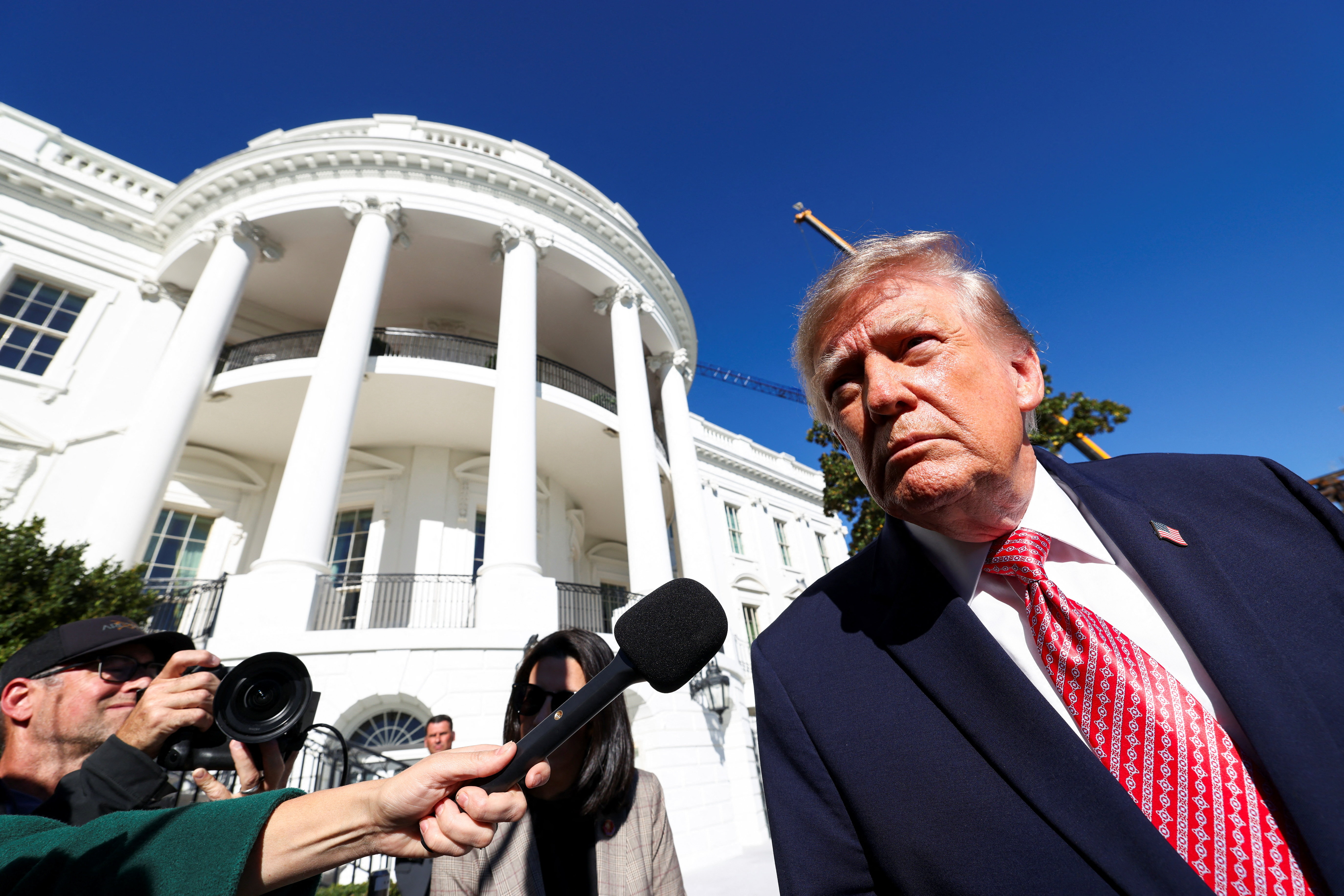US President Donald Trump speaks to members of the media as he departs the White House en route to Kansas, in Washington, DC, US, October 19, 2026.  REUTERS/Kevin Lamarque