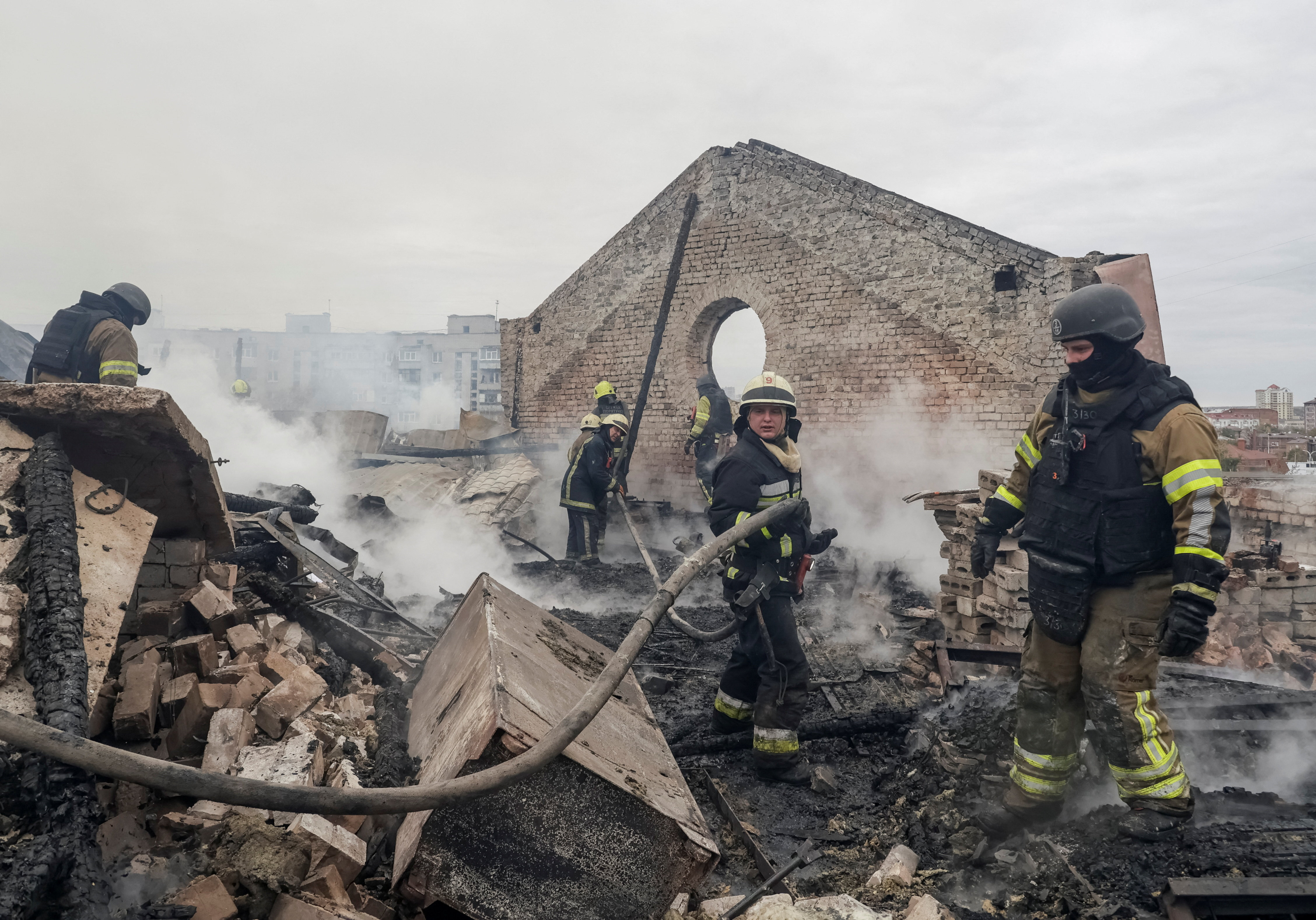 Firefighters work at the site of an office building damaged during a Russian jet drone strike, amid Russia's attack on Ukraine, in Kharkiv, Ukraine, October 23, 2026. REUTERS/Sofiia Gatilova