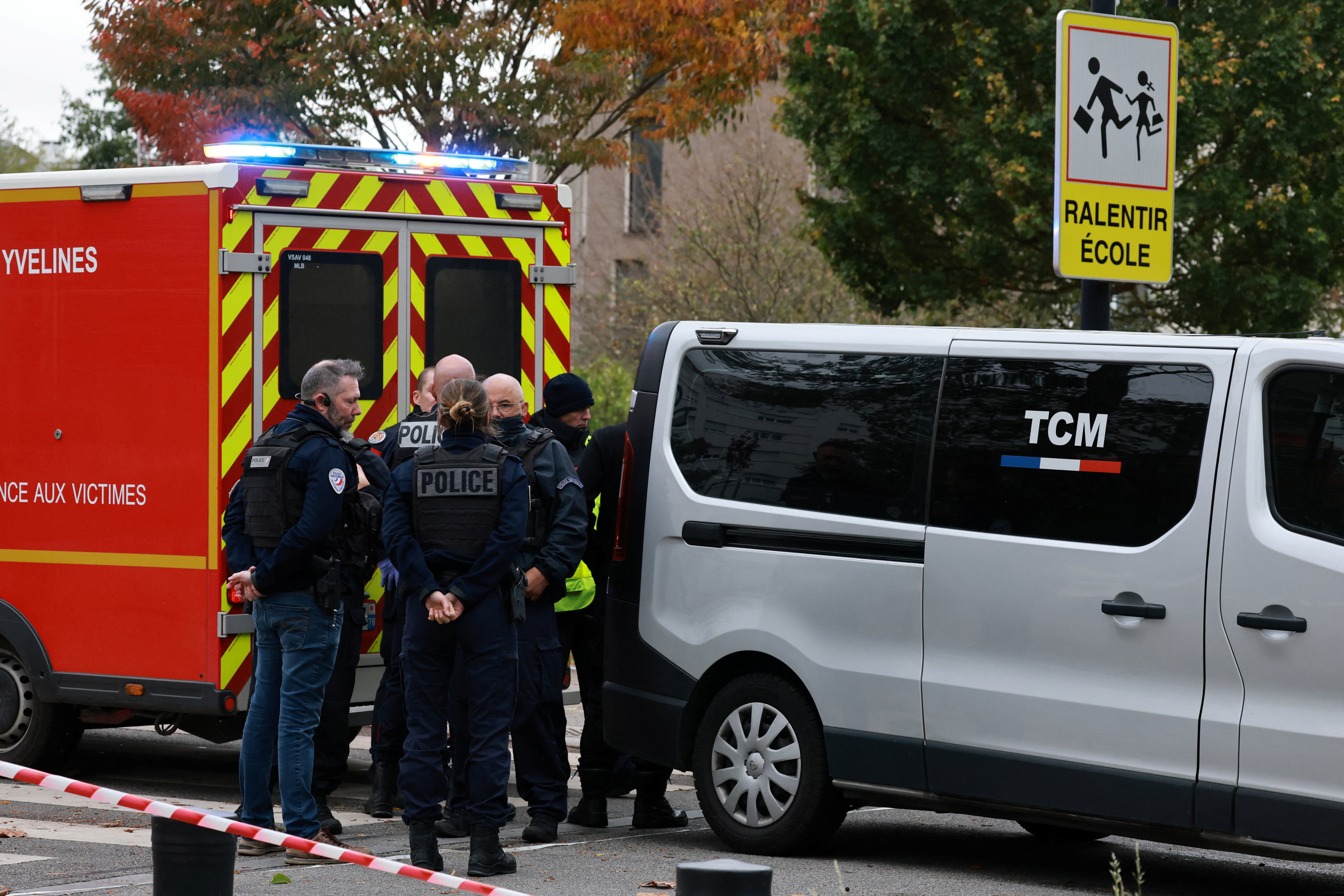 French police work at the scene after a drive-by shooting that killed one person and injured several others in Trappes, in the Yvelines department, near Paris, France, October 23, 2026. REUTERS/Stephanie Lecocq