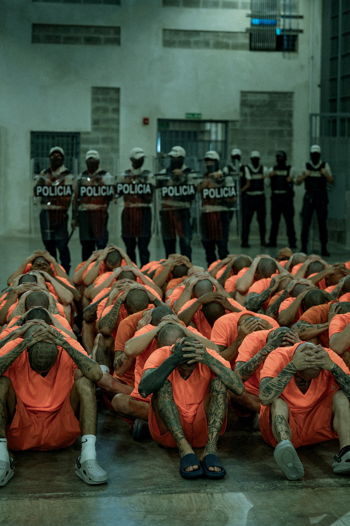 Inmates sit on the floor with their hands on their heads after being transferred to the Center for High Containment of Organized Crime (CACCO), a new maximum-security prison built in cooperation with the government of El Salvador President Nayib Bukele, in Alajuela, Costa Rica, in this handout image distributed on October 27, 2026. Ministerio de Justicia y Paz/Handout via REUTERS ATTENTION EDITORS - THIS IMAGE HAS BEEN SUPPLIED BY A THIRD PARTY. NO RESALES. NO ARCHIVES