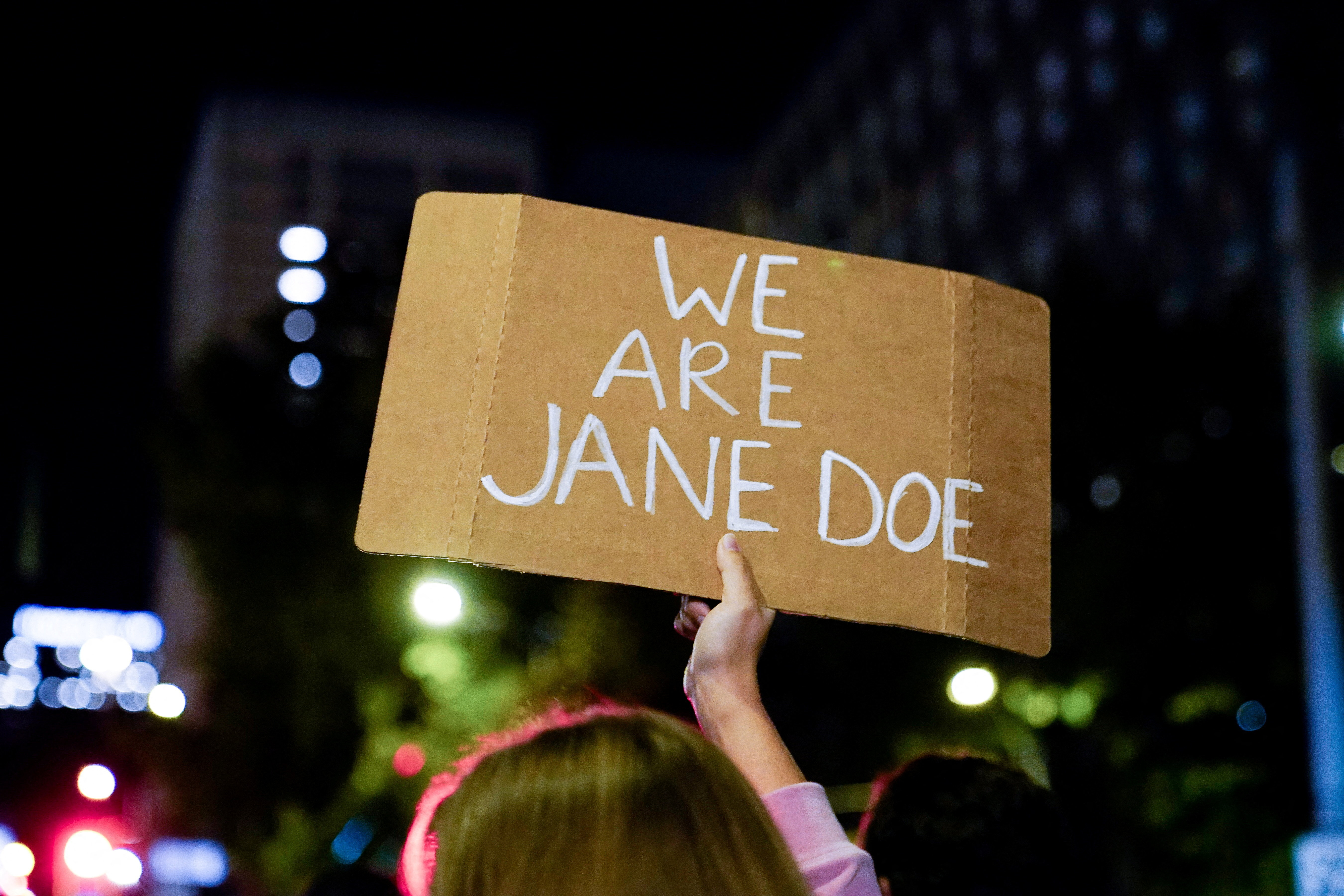 A person holds a sign as demonstrators gather for a "Stop Sexual Violence" protest as part of US rallies being held in the wake of the Cornell University rape allegations, in Seattle, Washington, US, October 8, 2026. REUTERS/David Ryder